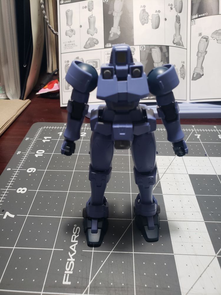 Purple plastic robot model.
Leo mobile suit from the show Mobile Suit Gundam Wing, standing before it's normal configuration (blown up).