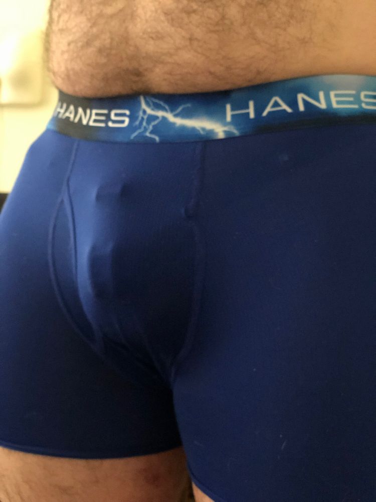 Chastity cage bulge in blue boxer briefs 
