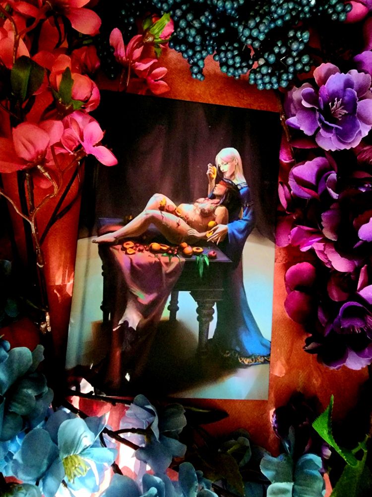 Blonde fae woman drizzle fruit juice on the plus size fmc as she lounges sensually on a table covered in fruit.