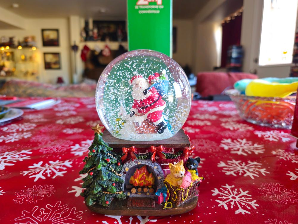 Refilled and repaired snowglobe with a happy Santa surrounded by falling snow