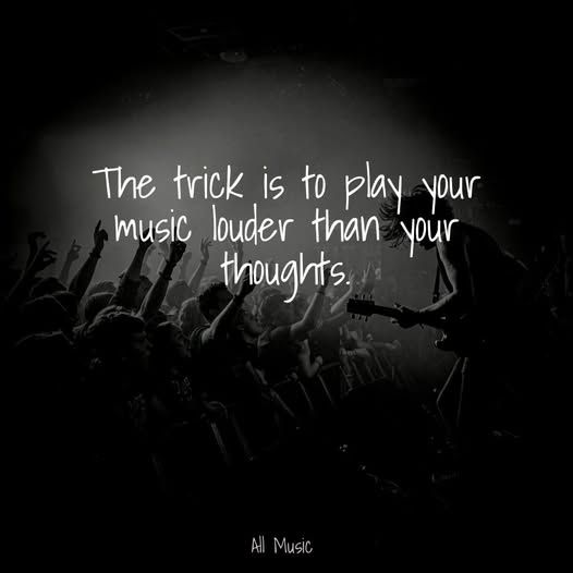 A BW photo of an electric guitarist rocking out on the edge of the stage with a package crowd arm in the air rocking along. The caption reads "The trick is to play music louder than your thoughts"