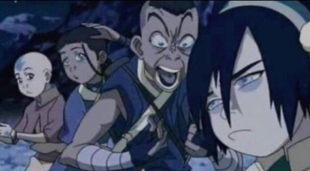 Sokka screaming into a tired Toph’s ear from The Chase episode in Avatar the Last Airbender.