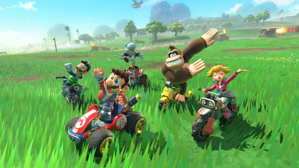 Mario Kart World free roam showing Mario, princess peach, and donkey Kong 
