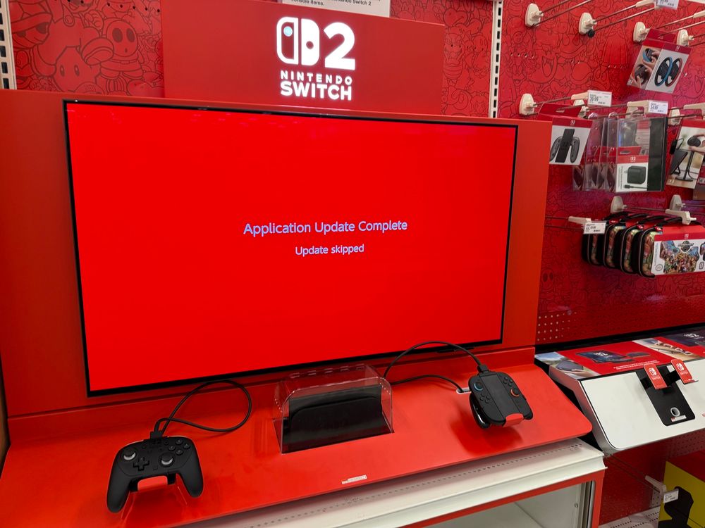 Switch 2 demo kiosk with a red screen and white text that reads “Application Update Complete Update skipped”