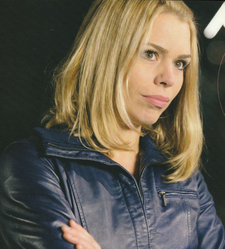 Rose.  Head and shoulders with her arms crossed.  From Turn Left.