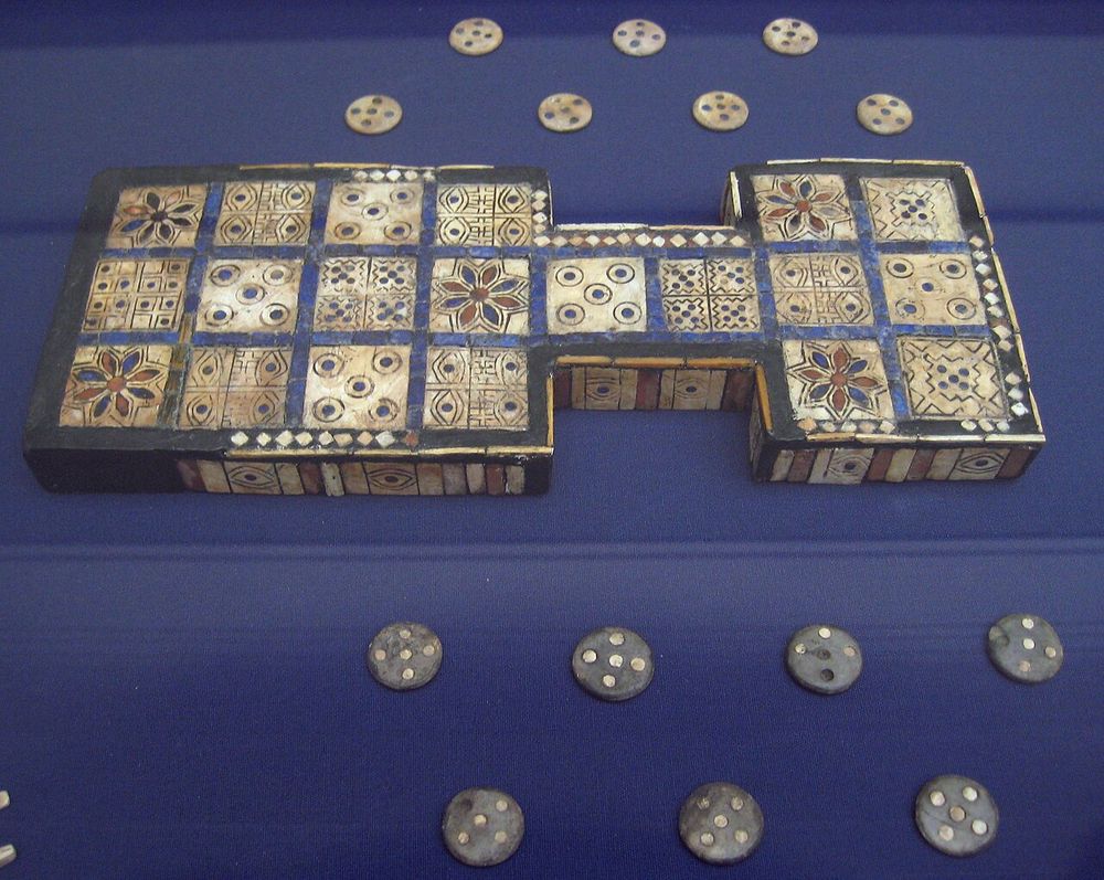 A picture of the Royal Game of Ur. Thought to be one of, if not the oldest board games in the world.

From Wikipedia: 

"The game was popular across the Middle East among people of all social strata, and boards for playing it have been found at locations as far away from Mesopotamia as Crete and Sri Lanka. One board, held by the British Museum, is dated to c. 2600 – c. 2400 BC, making it one of the oldest game boards in the world."