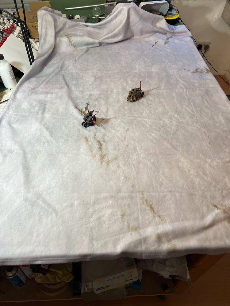 Winter is Coming 6’x4’ fleece battlemat from Geek Villain with Oldhammer Skaven doomwheel and Empire steam tank ready to duel.