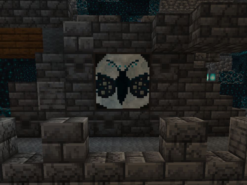 This painting is called Omens Wing. It features the silhouette of a moth, or perhaps a human like creature descending in front of the moon.