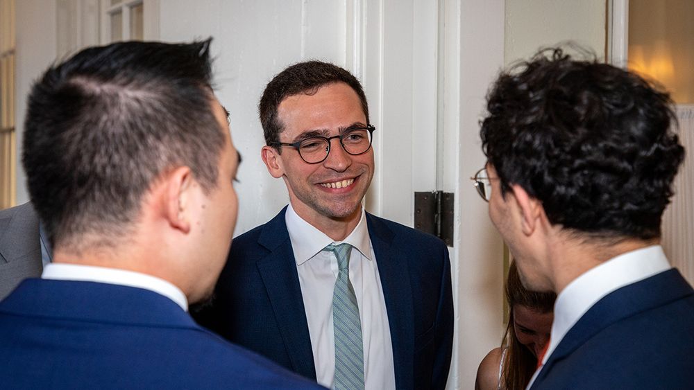 Chief resident Tom Wozny, MD speaks with his fellow residents.
