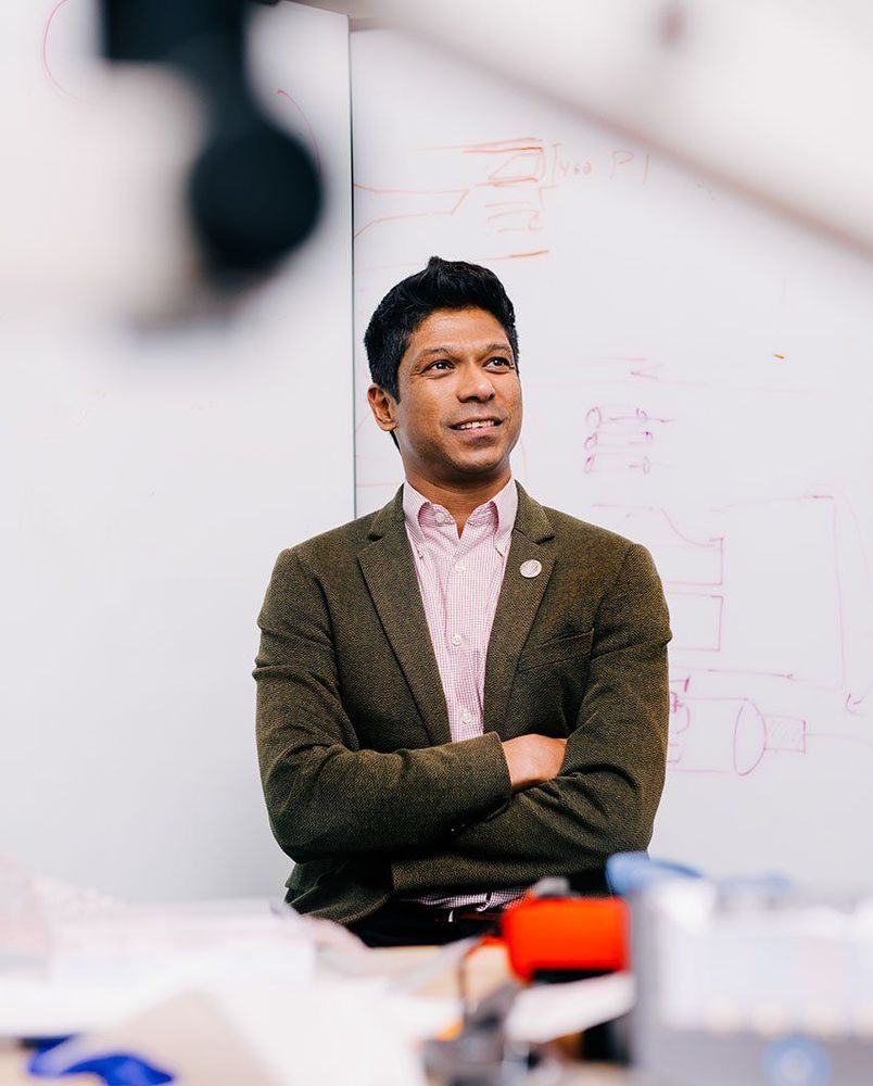 UCSF neurologist and pain medicine specialist Prasad Shrivalkar, MD, PhD, standing in front of a whiteboard. Photo: Anastasiia Sapon.