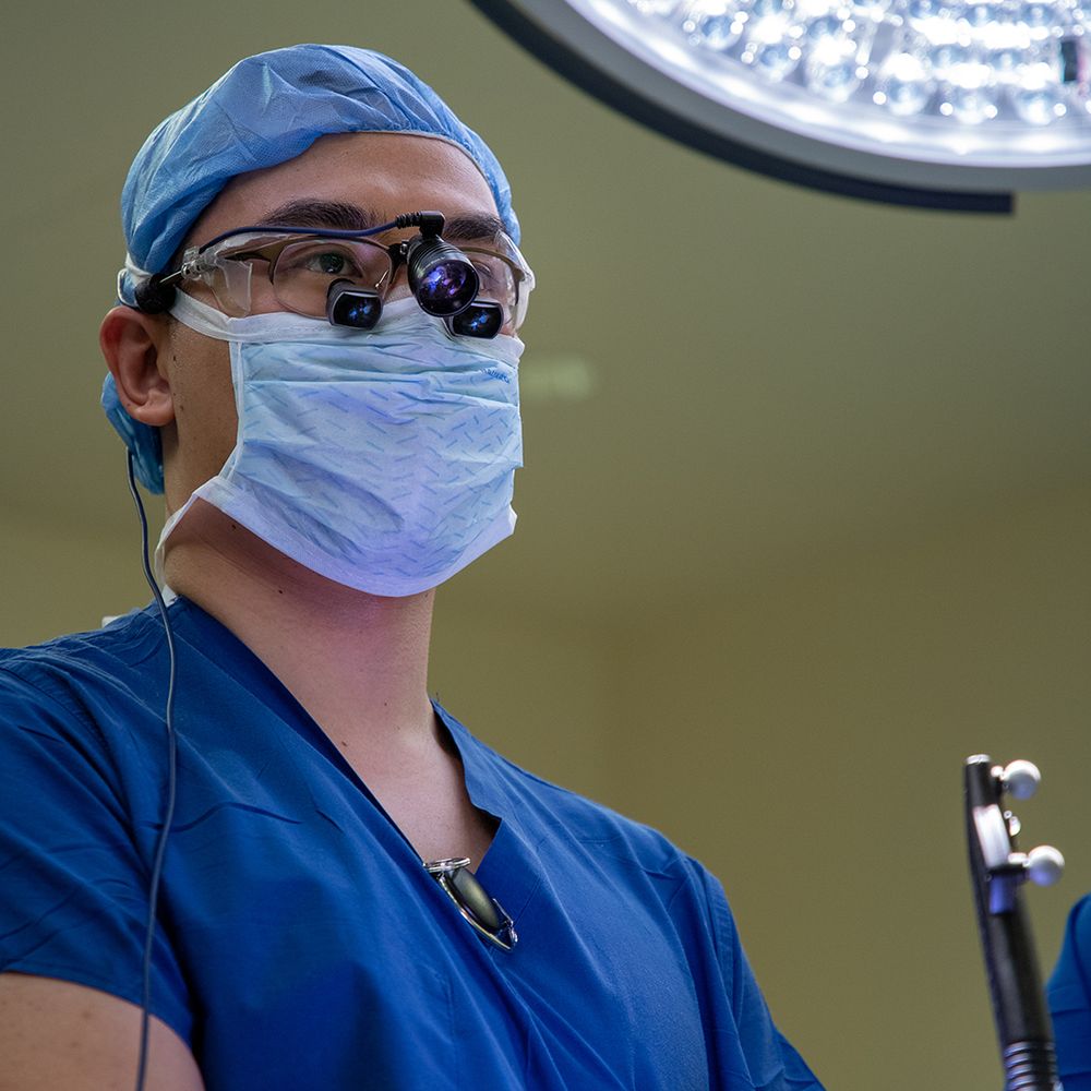 Close-up of John Yue, MD, during a stereoelectroencephalography (sEEG) procedure.
