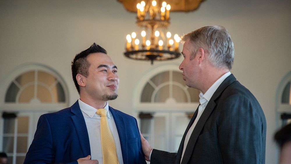 UCSF neurosurgeon, Ethan Winkler, MD, PhD (right) congratulates chief resident John Yue, MD (left).