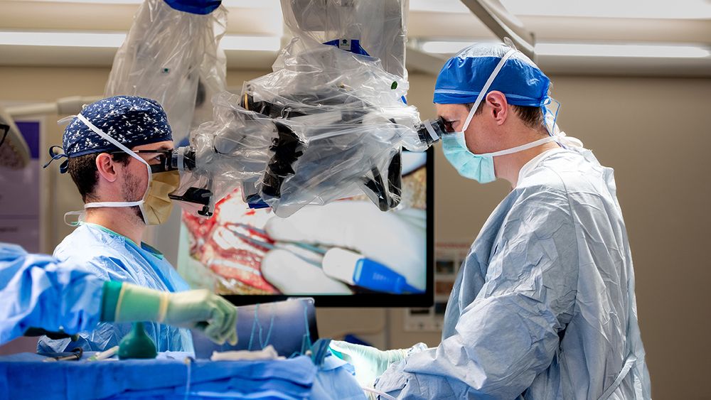 Chief resident Thomas Wozny, MD, with cerebrovascular neurosurgeon Luis Savastano, MD, PhD, during a bypass surgery to treat moyamoya disease.