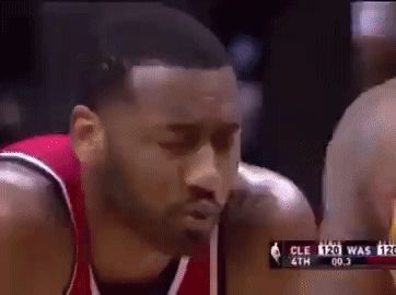 a close up of a basketball player 's face during a game