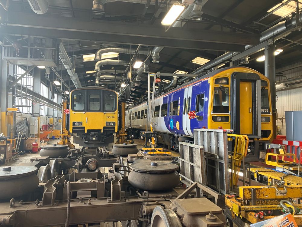 Sprinters 150128 and 158758 sat inside the depot. (150128s bogies sat in the foreground)
