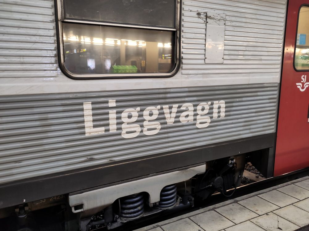 Train side with sign in Swedish saying liggvagn. Literally lying down carriage. But a ligg is also slang for a shag 