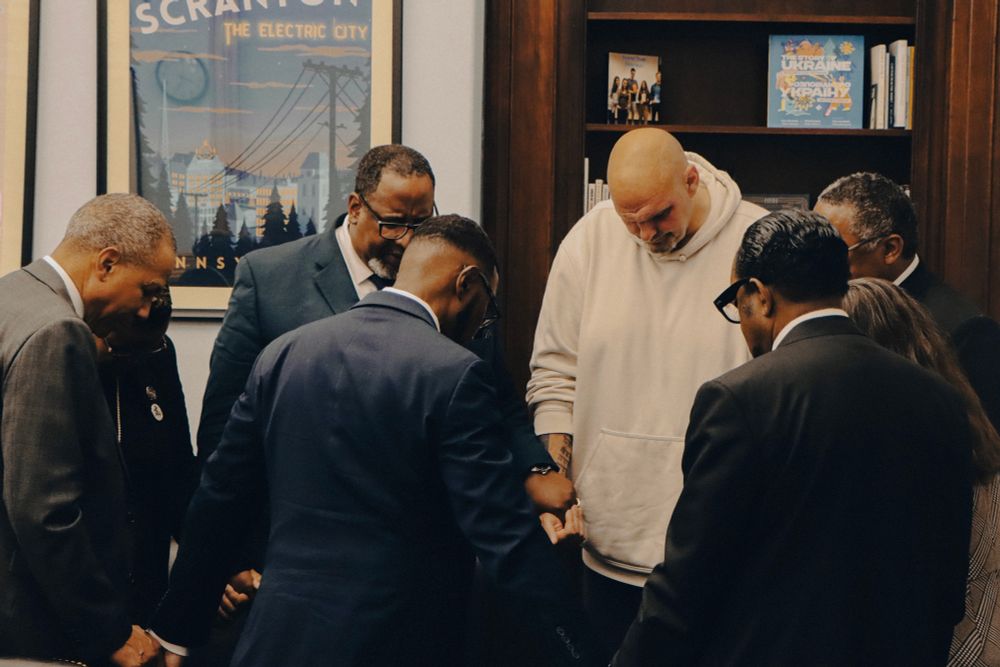 Surrounded by religious leaders from Pennsylvania and across the country, Senator Fetterman and the group bow their heads in a circle of prayer.
