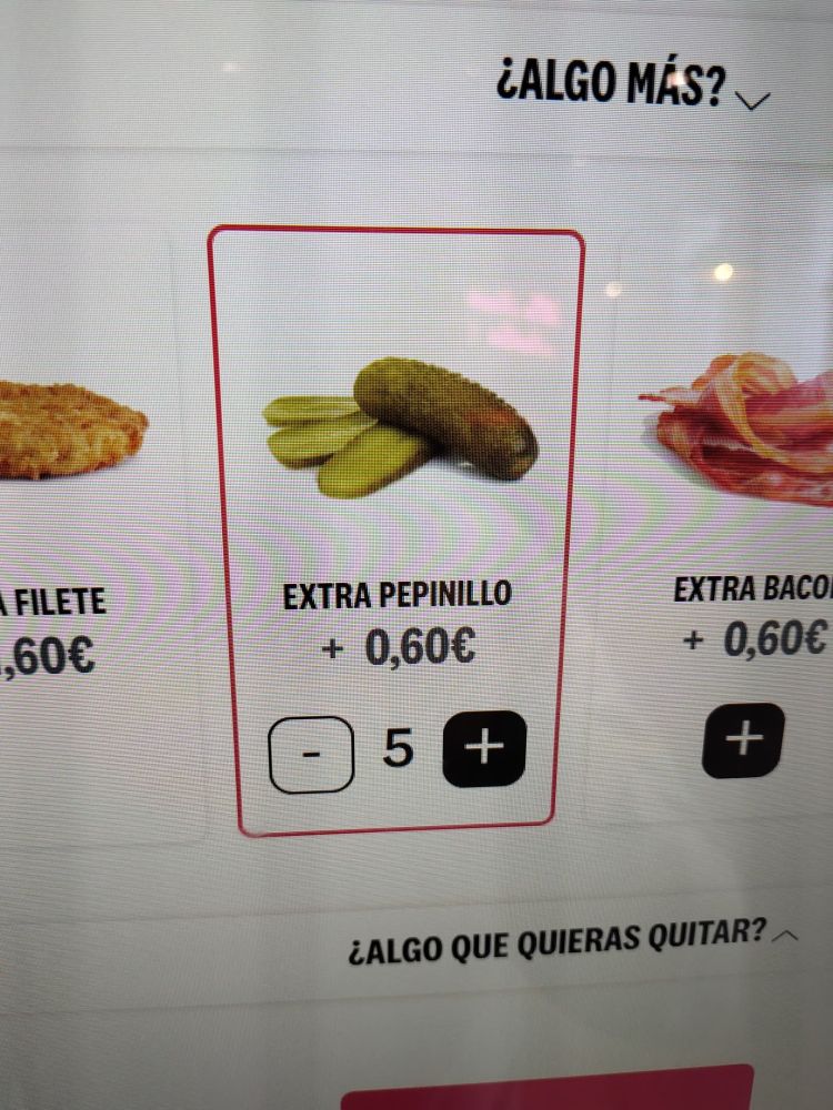 KFC self-service machine displaying a selection of ×5 pickles 