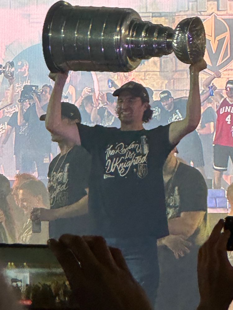 Vegas Golden Knights captain Mark Stone lifting the Stanley Cup at the team’s celebration party honoring their Cup Final victory - T-Mobile Arena, LV Strip