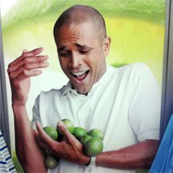 A man failing to hold onto a dozen limes 