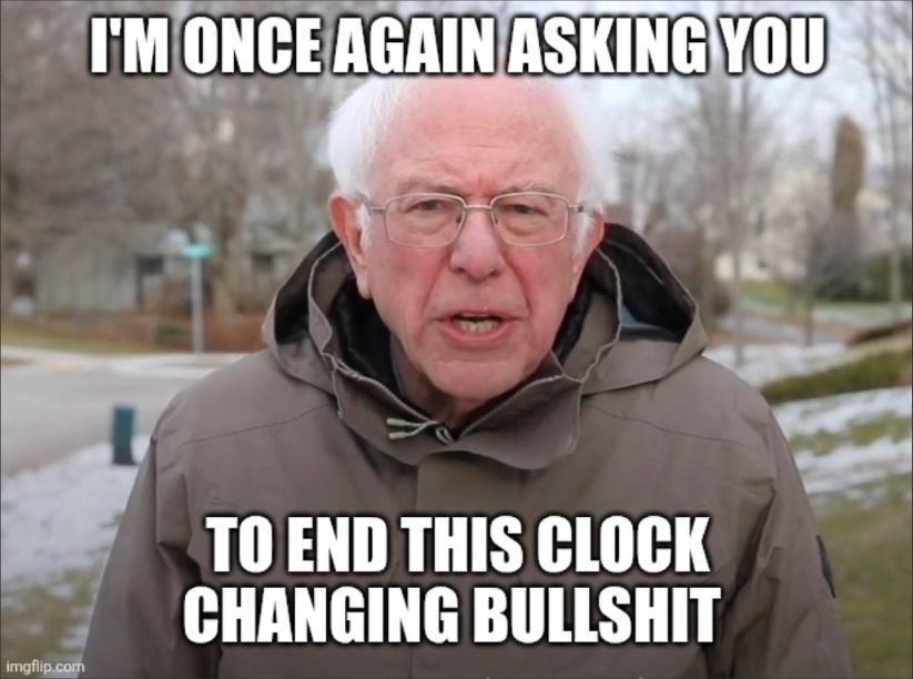 Bernie Sanders meme reads "I'm once again asking you to end this clock changing bullshit"