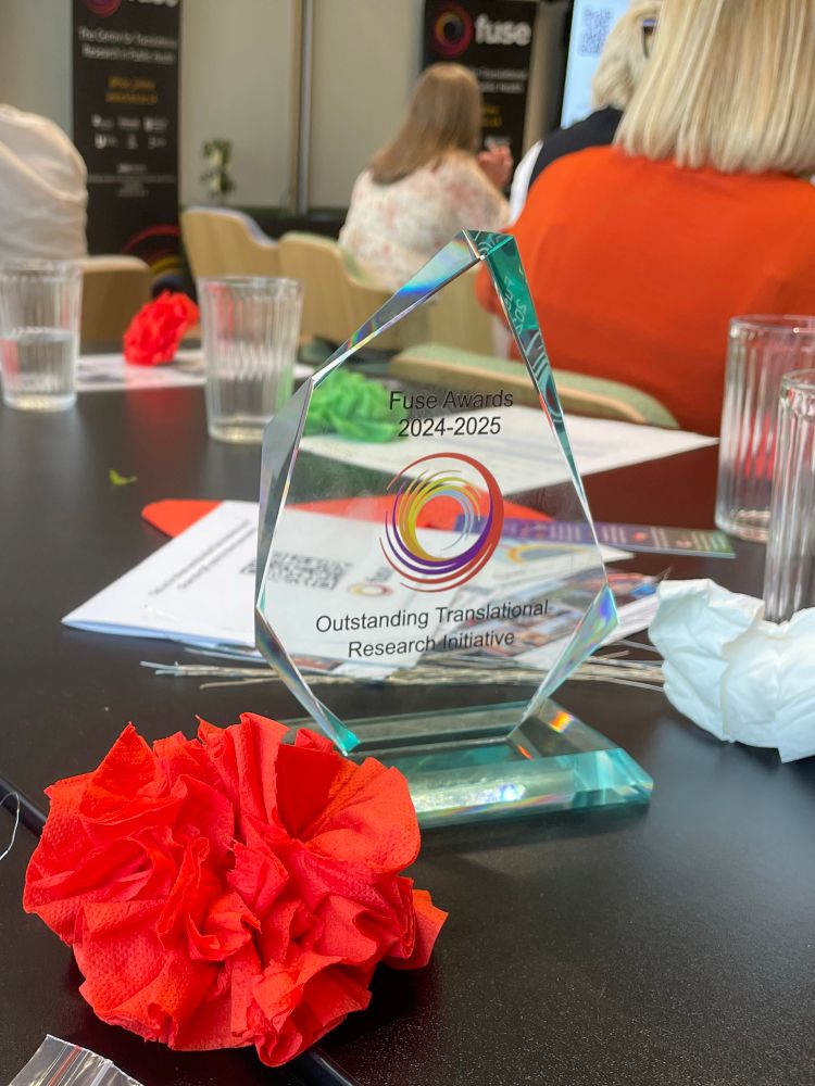 Glass award and paper flower 