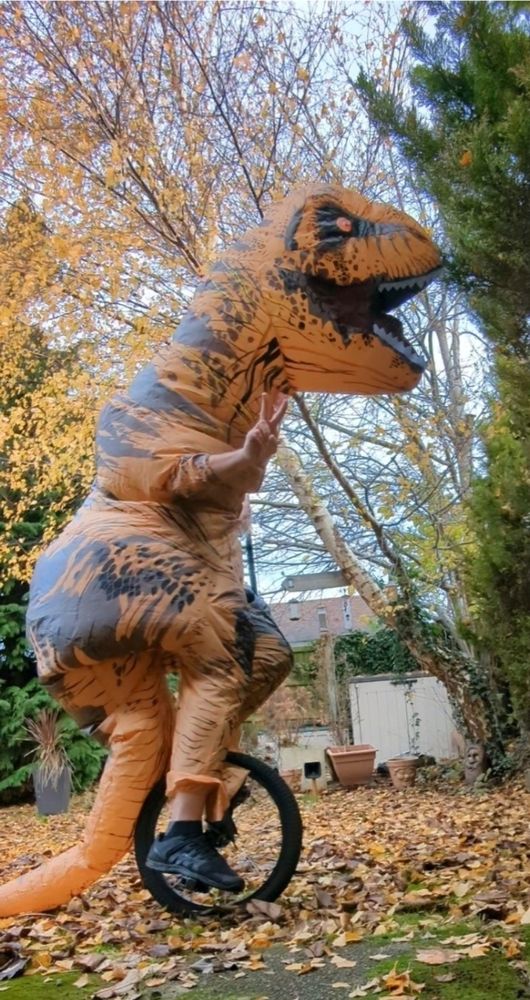 A T-Rex on a unicycle.