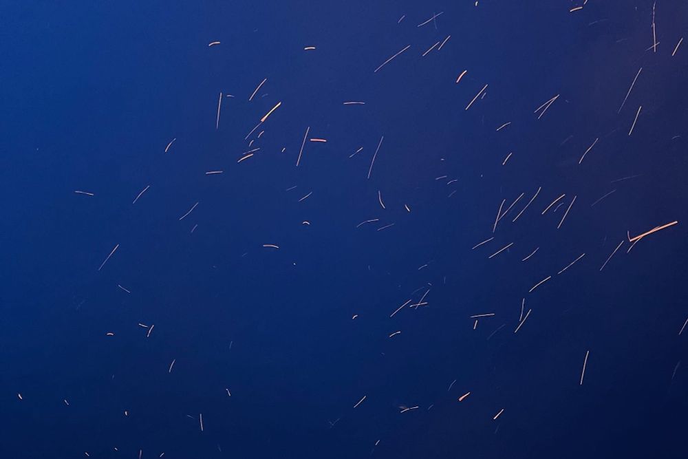 sparks flying against a deep blue sky
