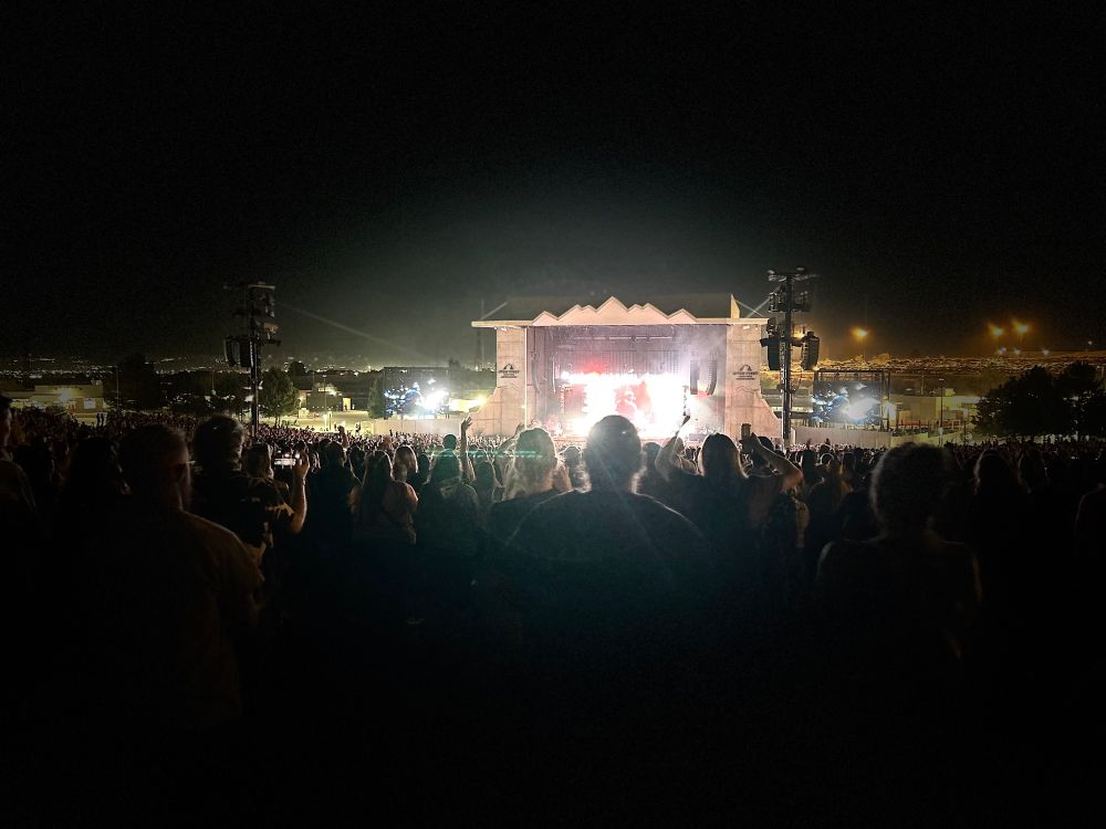A photo of a lit up stage at an amphitheater in Utah. Hozier is playing. He seems like a good dude. 