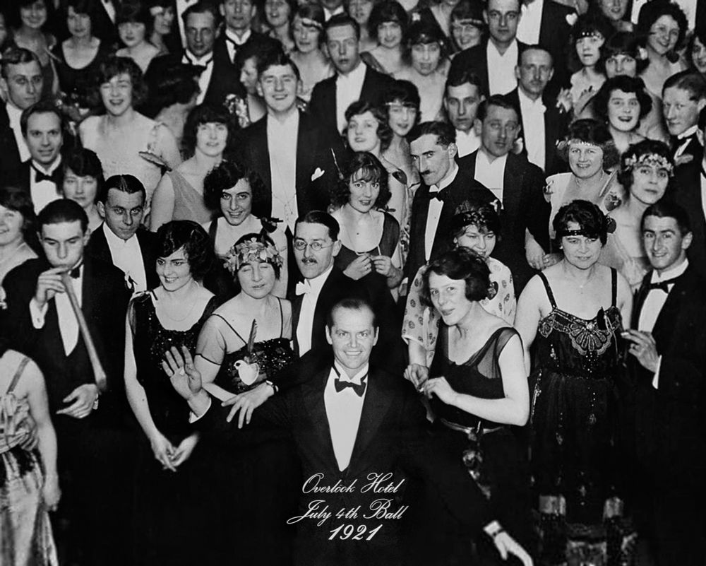 A photograph from the movie The Shining. It’s a black and white photo of revelers in black tie formalwear and gowns. A man stands at the center, smiling. It’s labeled “Overlook Hotel, July 4th Ball, 1921”