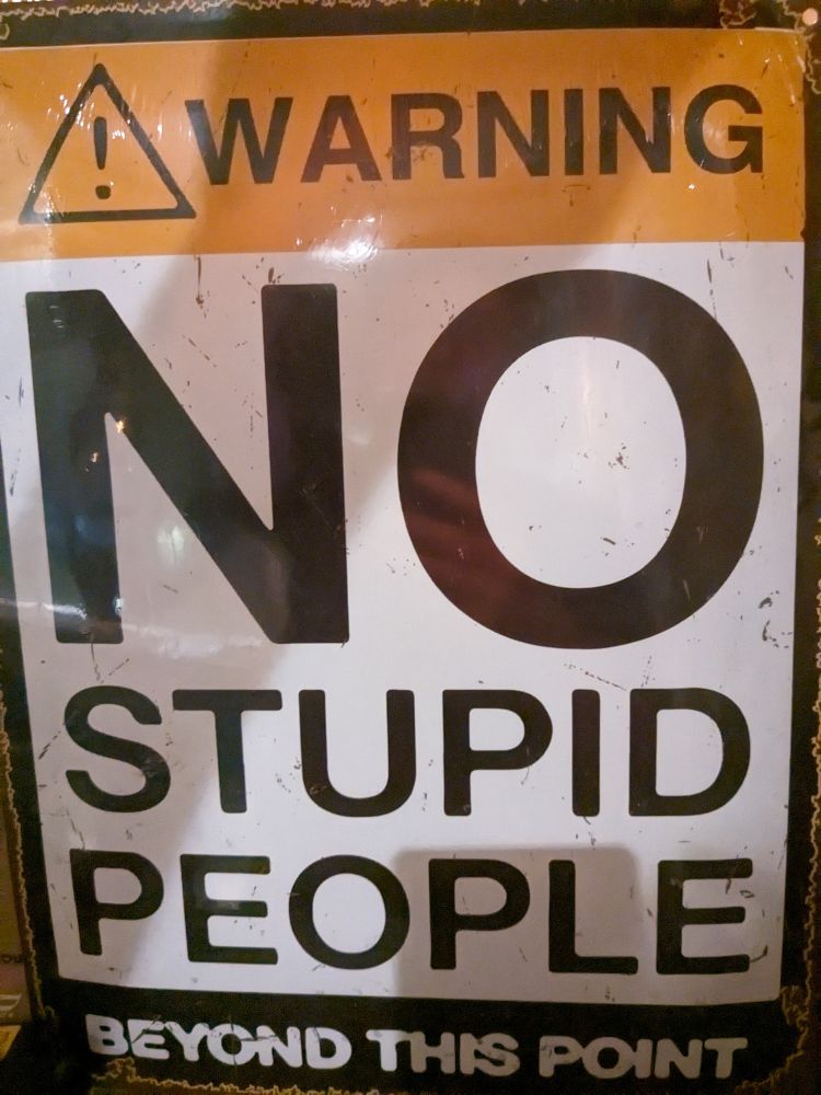 Warning sign - no stupid people beyond this point