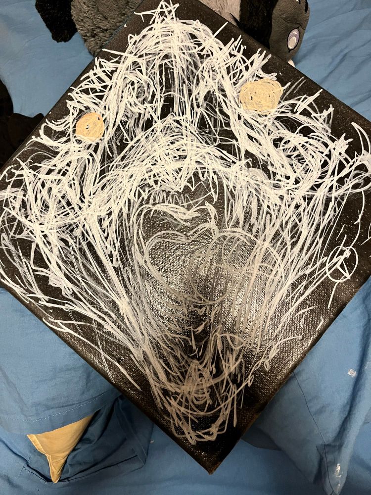 White sketch on a black background of a dragon roaring towards the viewer. I mean it’s currently a mass of scribbles, but I promise a dragon’s in there somewhere 