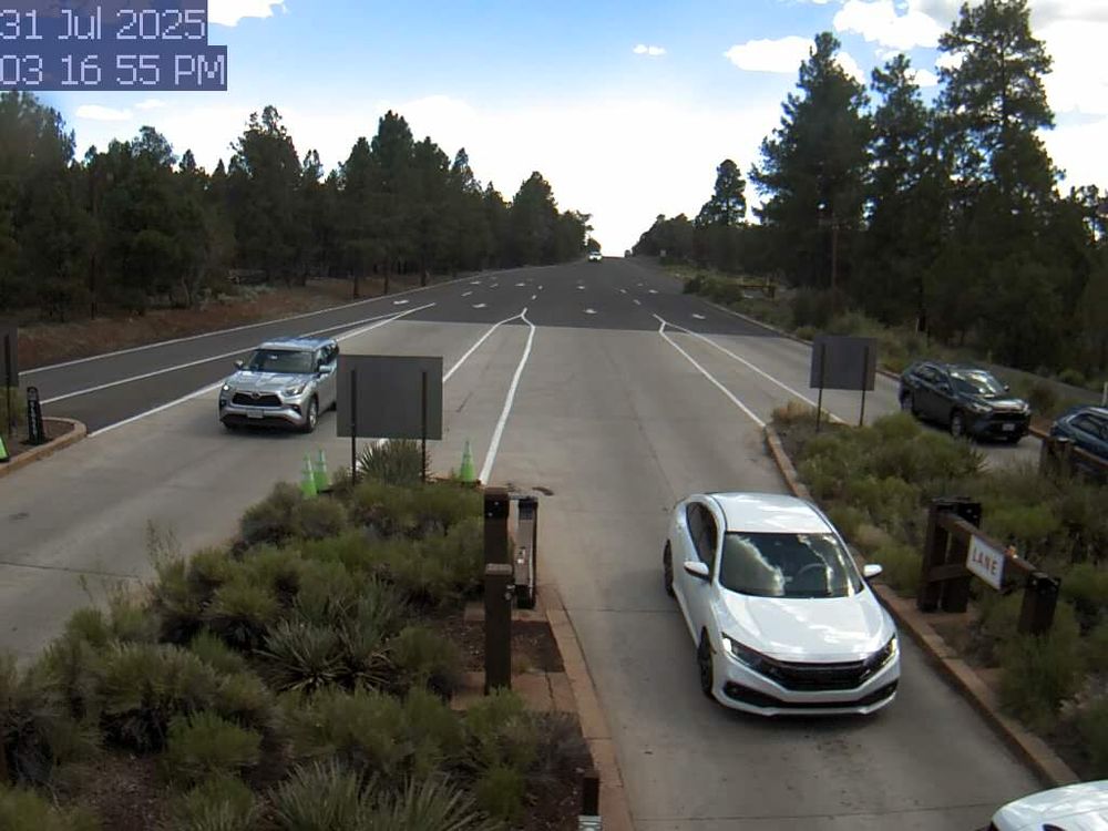 To help time your South Rim arrival, monitor the South Entrance Station Webcam. During busy weekends, there can be long lines and up to two hour wait times between 10 am - 5 pm. This view refreshes every minute. The entrance station is about 1.6 miles (2.5 km) north of the gateway town of Tusayan, AZ.
