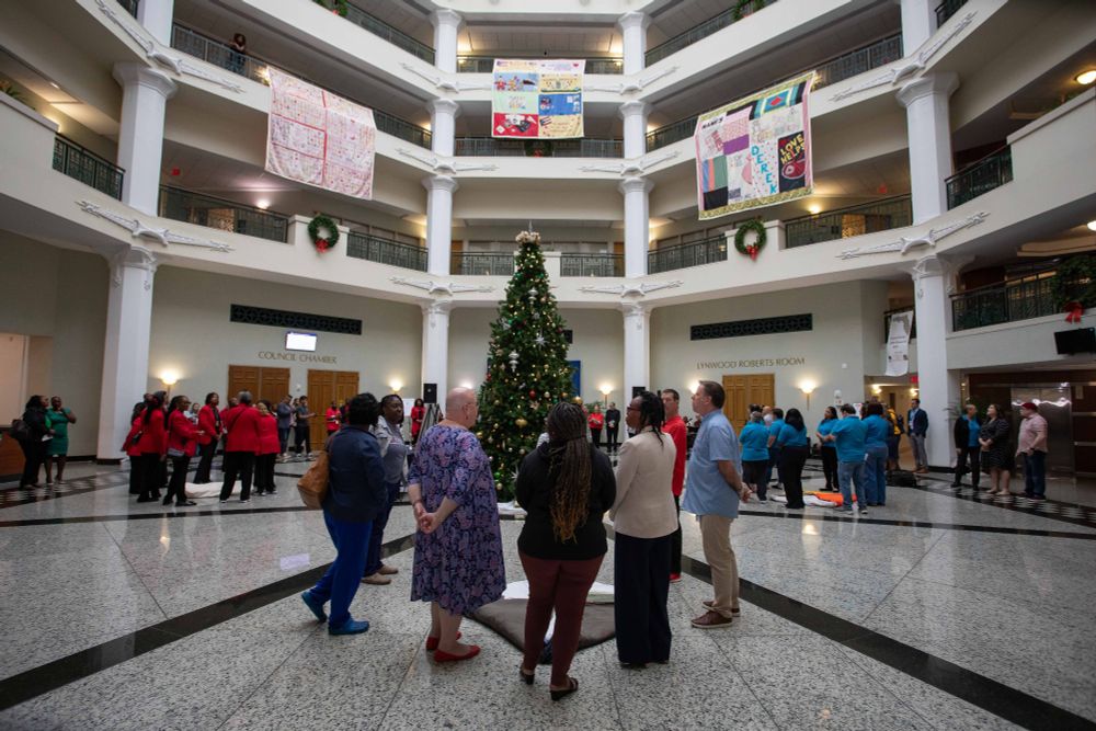 world aids day quilts hanging in the city hall atrium