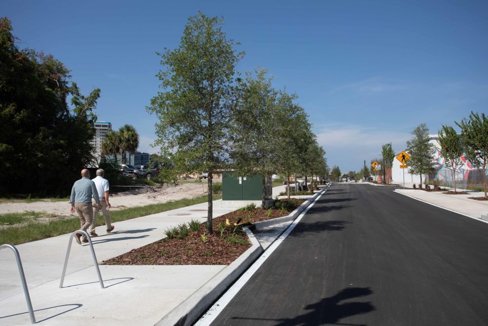 photo shows park street with new pavement, wider sidewalks, and enhanced landscaping