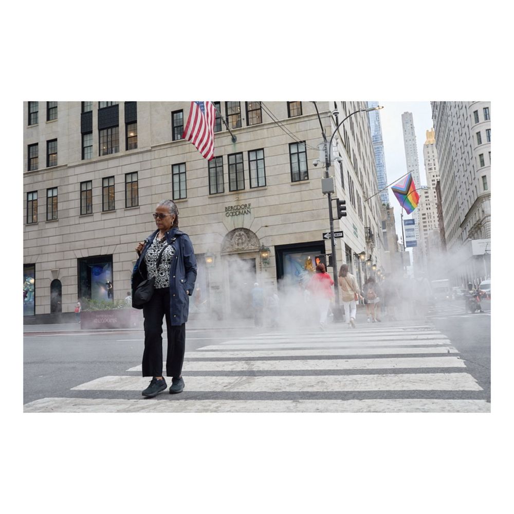 Photograph by JP Keating of a woman crossing 5th avenue, June 2025