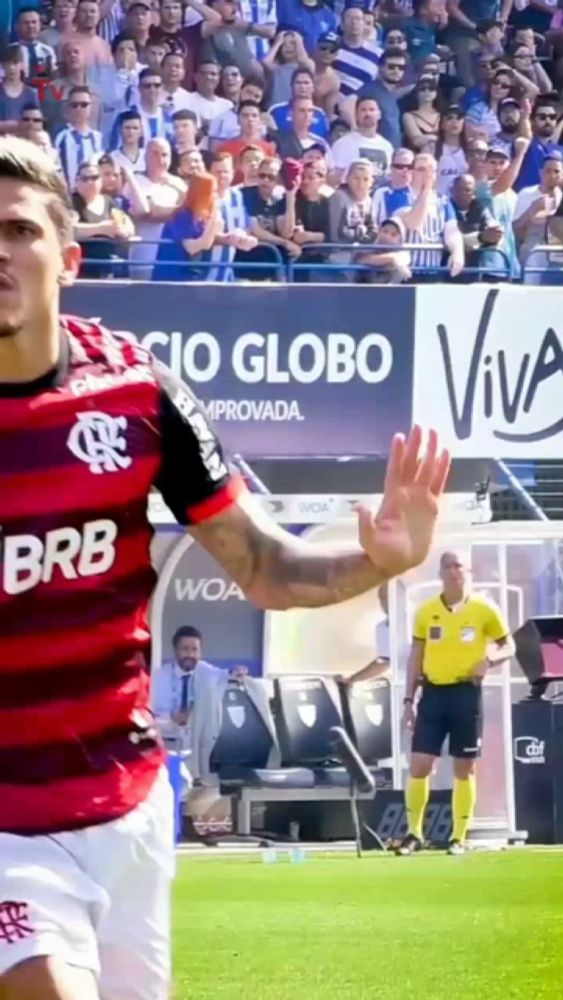 a soccer player wearing a jersey that says brb is waving