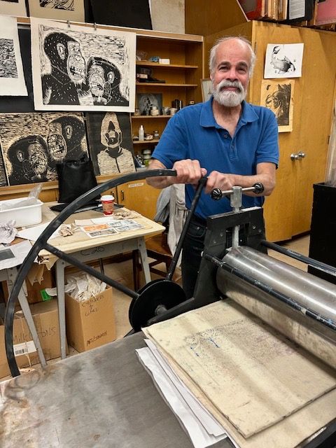 Learner in art of etching class