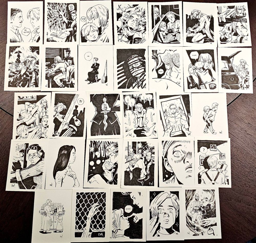 31 sketch cards on table with many scenes from the comic book MADAM