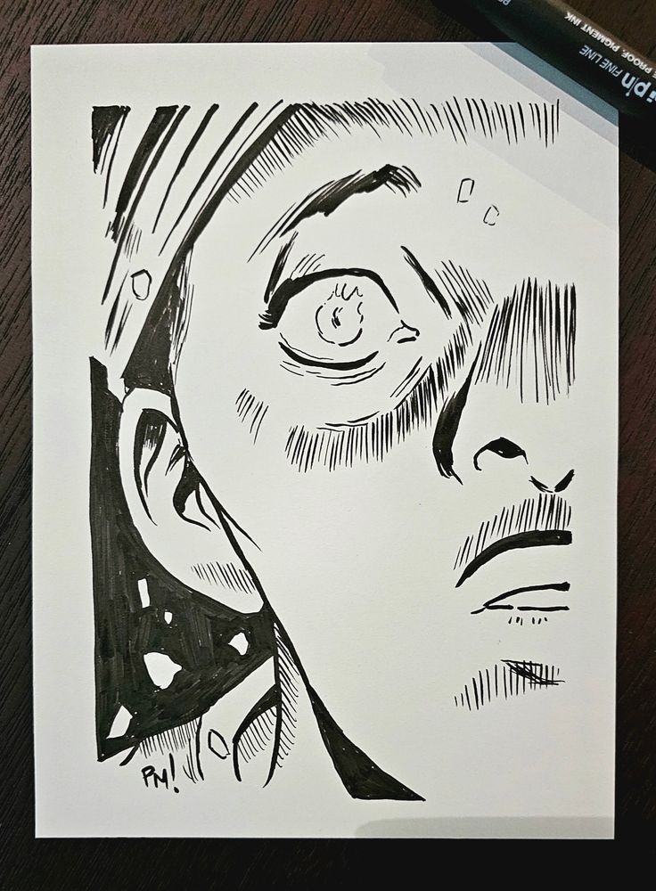 A woman looks on in shock at a blaze in front of her, its destructive power reflecting in her eyes.