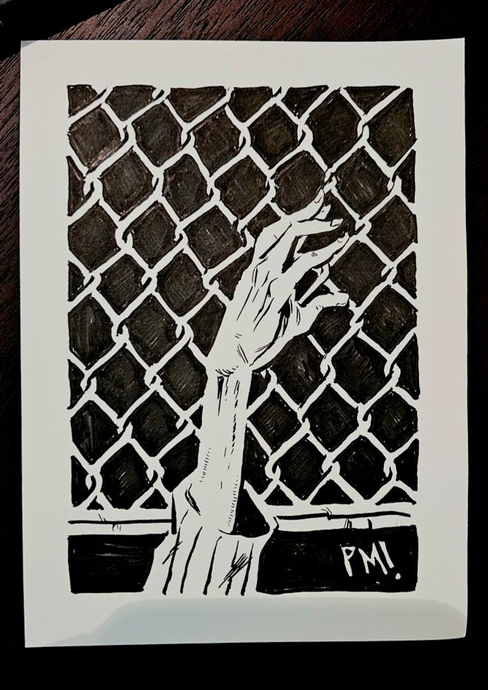 a skeletal arm reaches from a pit.