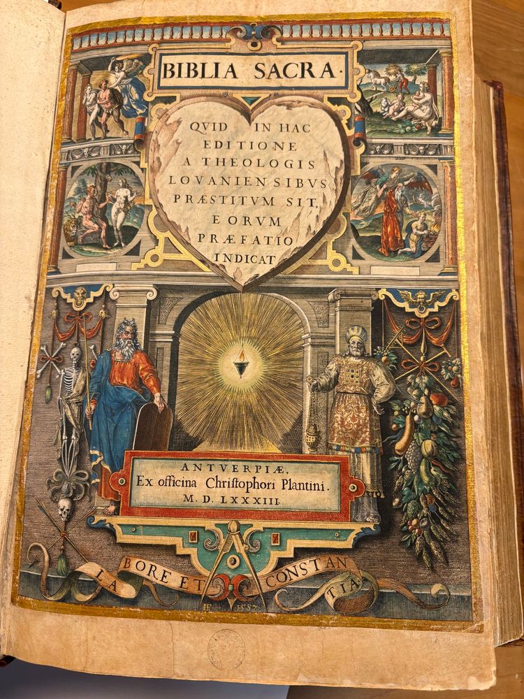 Handcoloured engraved title page of the Biblia sacra with allegorical figures and the imprint and Plantin’s printer’s mark