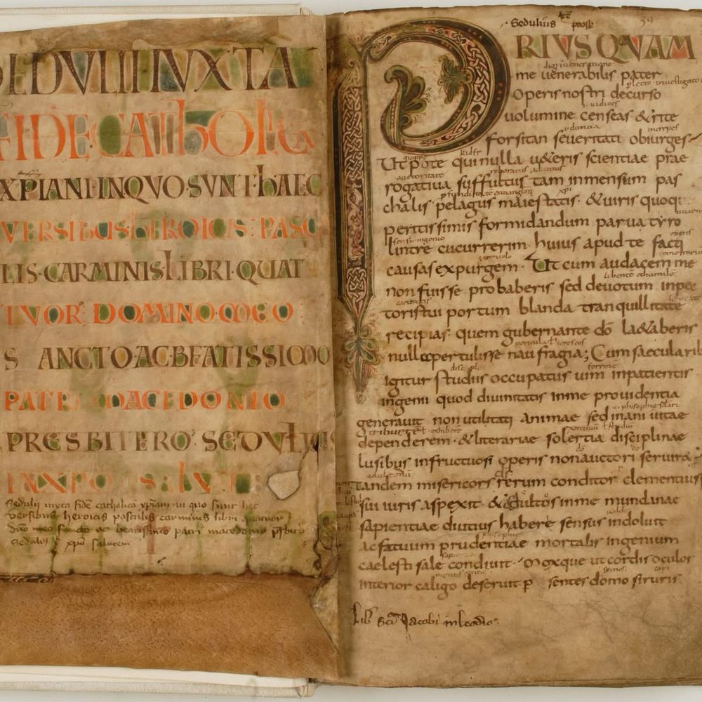 Opening parchment pages of the 8th-century manuscript written in an Karolingian script and a large opening initial letter P on the right