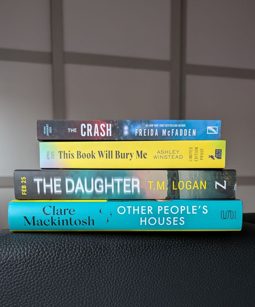 Books stacked. The Crash by Freida McFadden, This Book will Bury Me by Ashley Winstead, The Daughter by TM Logan, Other People's Houses by Clare Mackintosh 