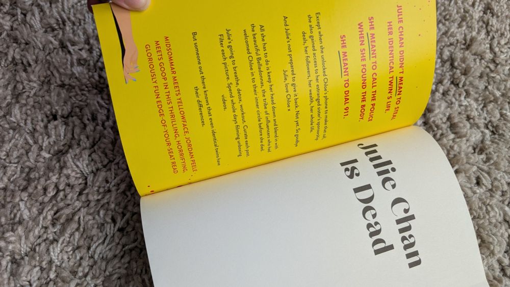 Julie Chan is Dead by Lianne Zhang. Book is open showing title page.
