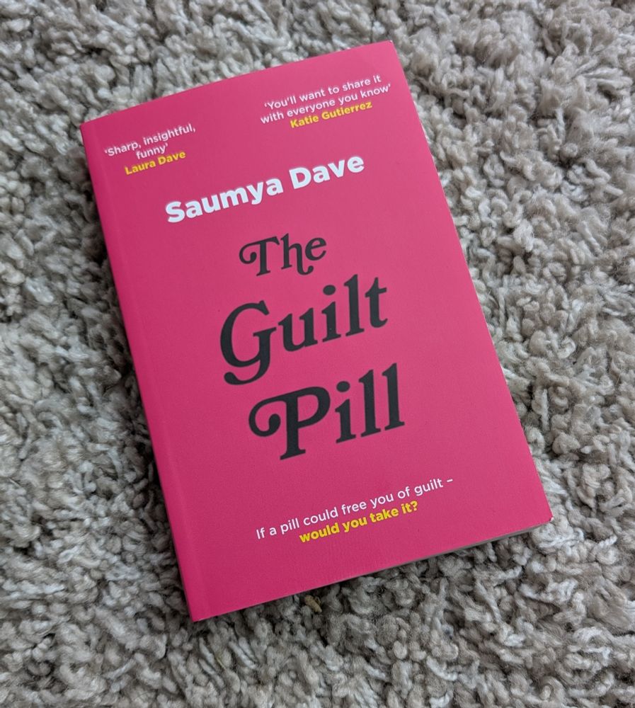 The Guilt Pill by Saumya Dave lying on rug