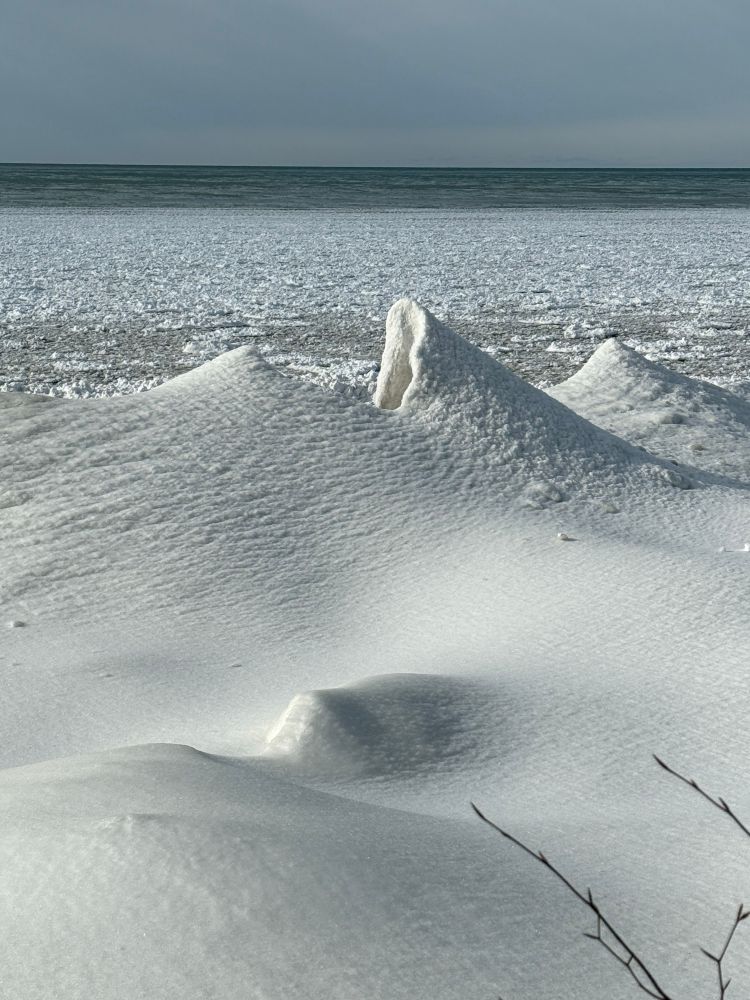 Snow volcano on Lake Ontario. A snow volcano is a temporary outcome of a partially frozen lake. 
