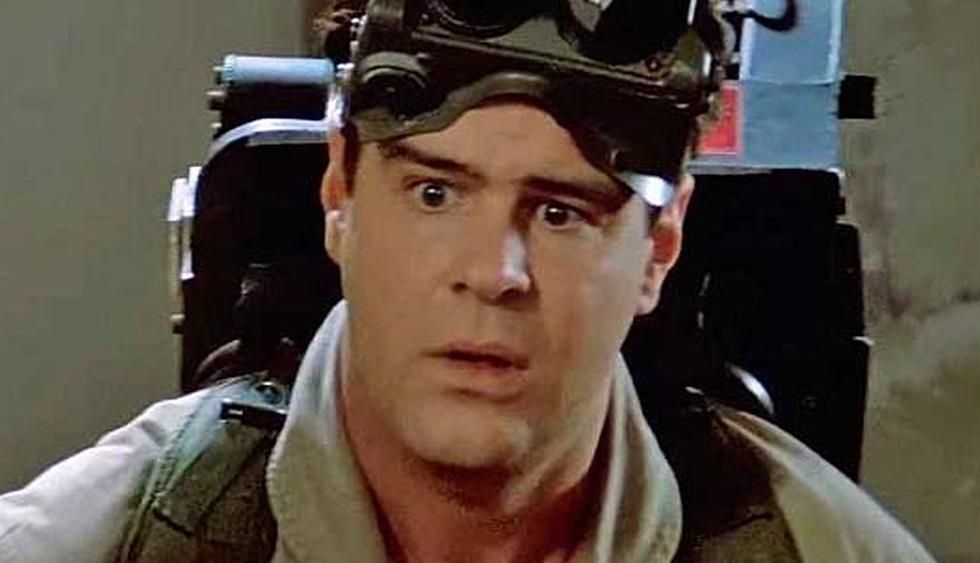 Dan Akryod as Ray Stantz in the 194 film Ghostbusters. He is wearing science goggles and a khaki uniform. The look on his face is one of utter confusion.