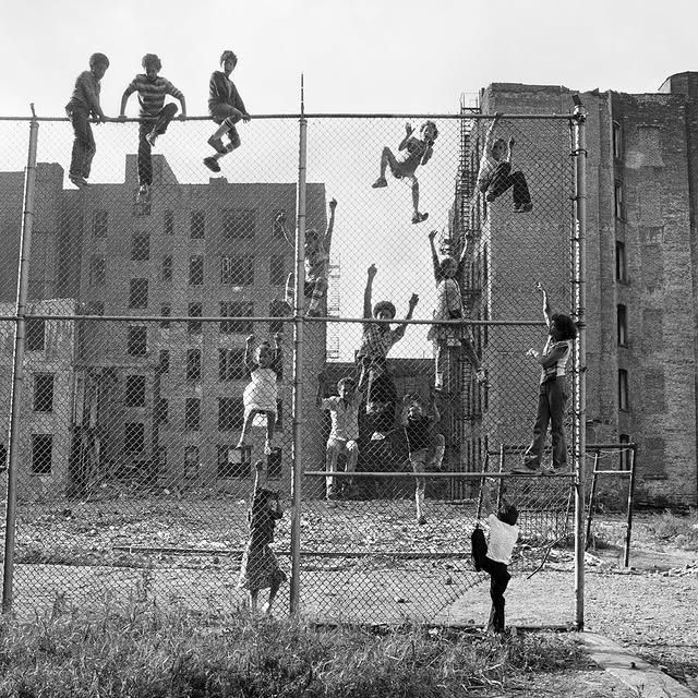 'Kids Climbing a Fence in an Abandoned Lot, Lower East Side,' Martha Cooper, 1978