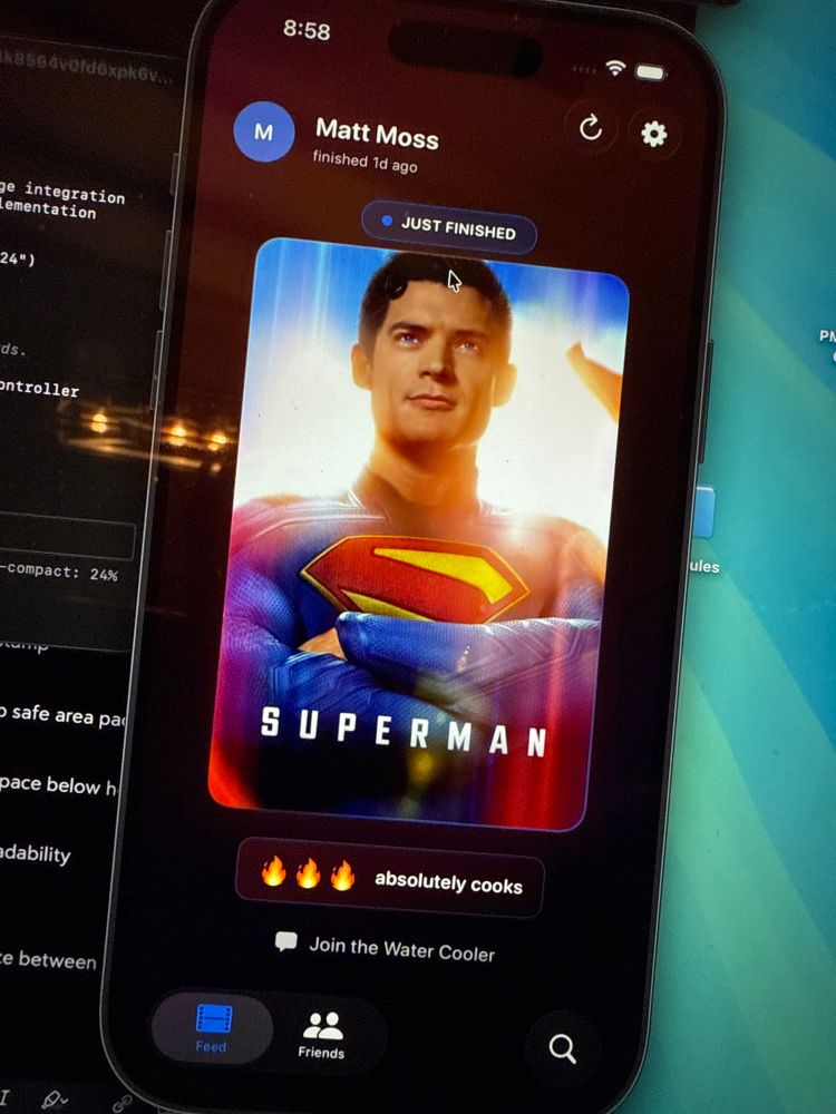 iOS simulator on macOS with a Superman movie card and user rating for the movie 